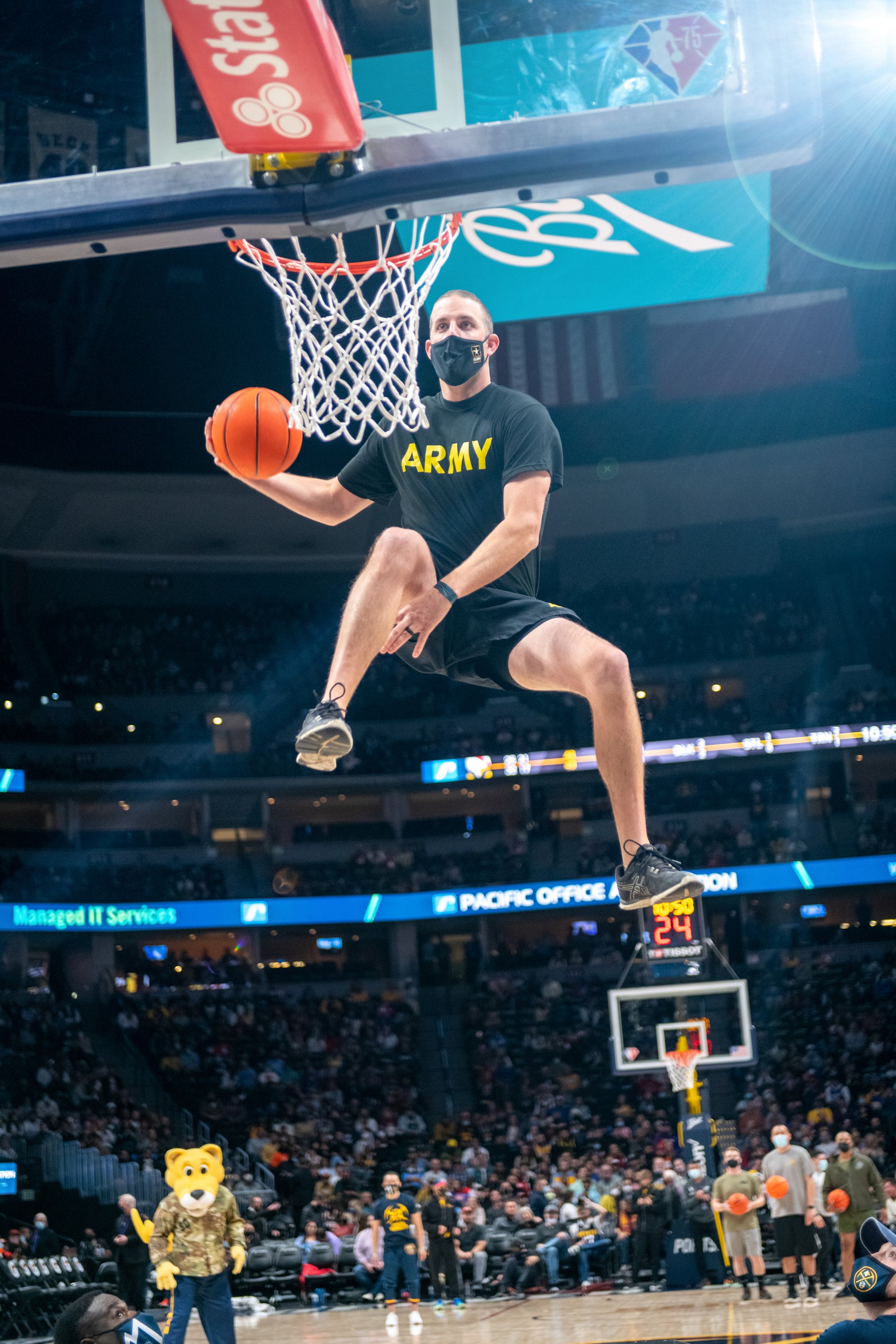 A soaring moment captured courtside at a Nuggets game