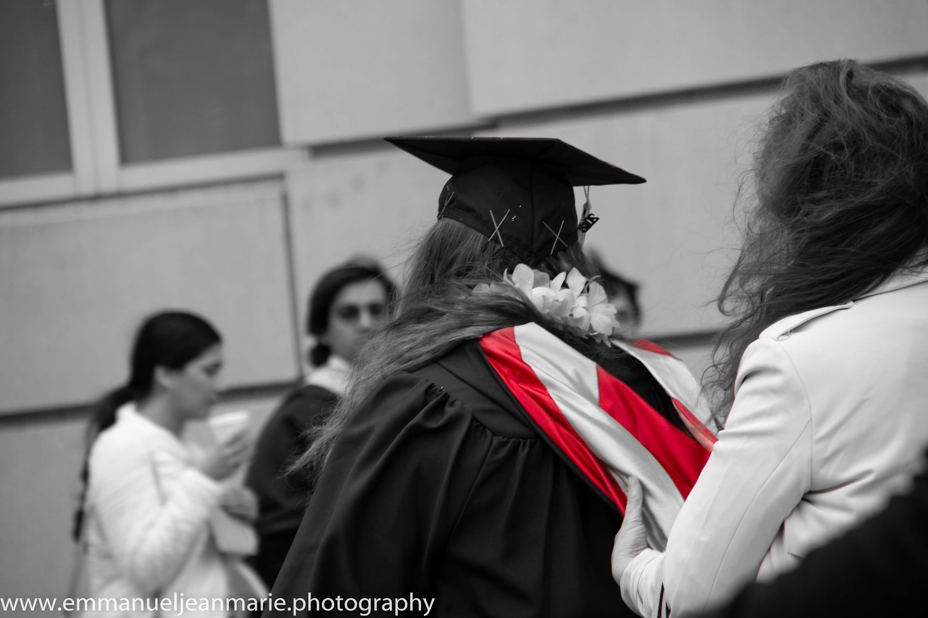 A graduate embraced on commencement day
