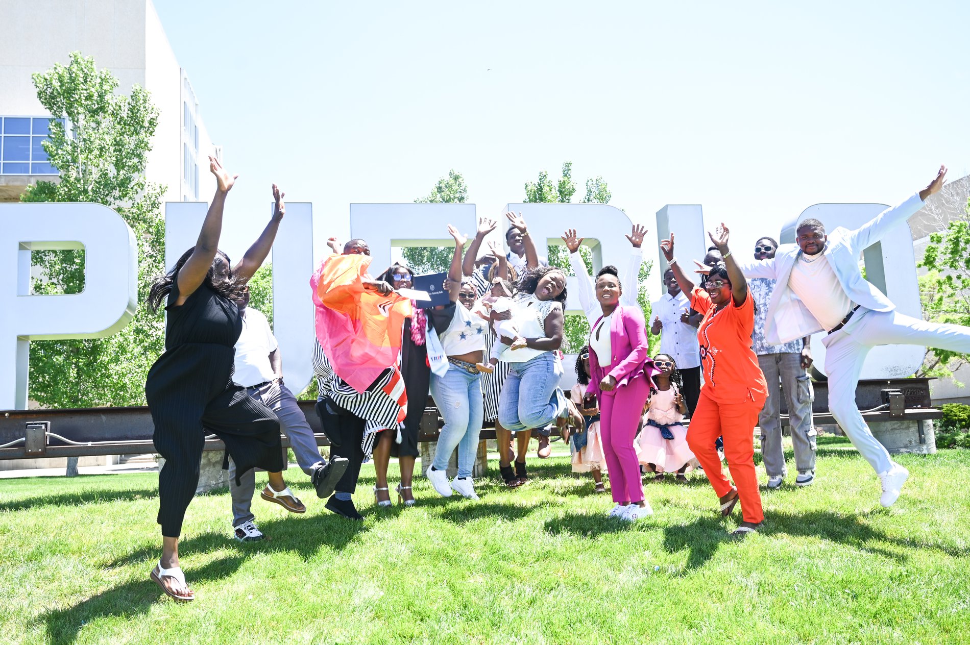 Graduates celebrating on campus