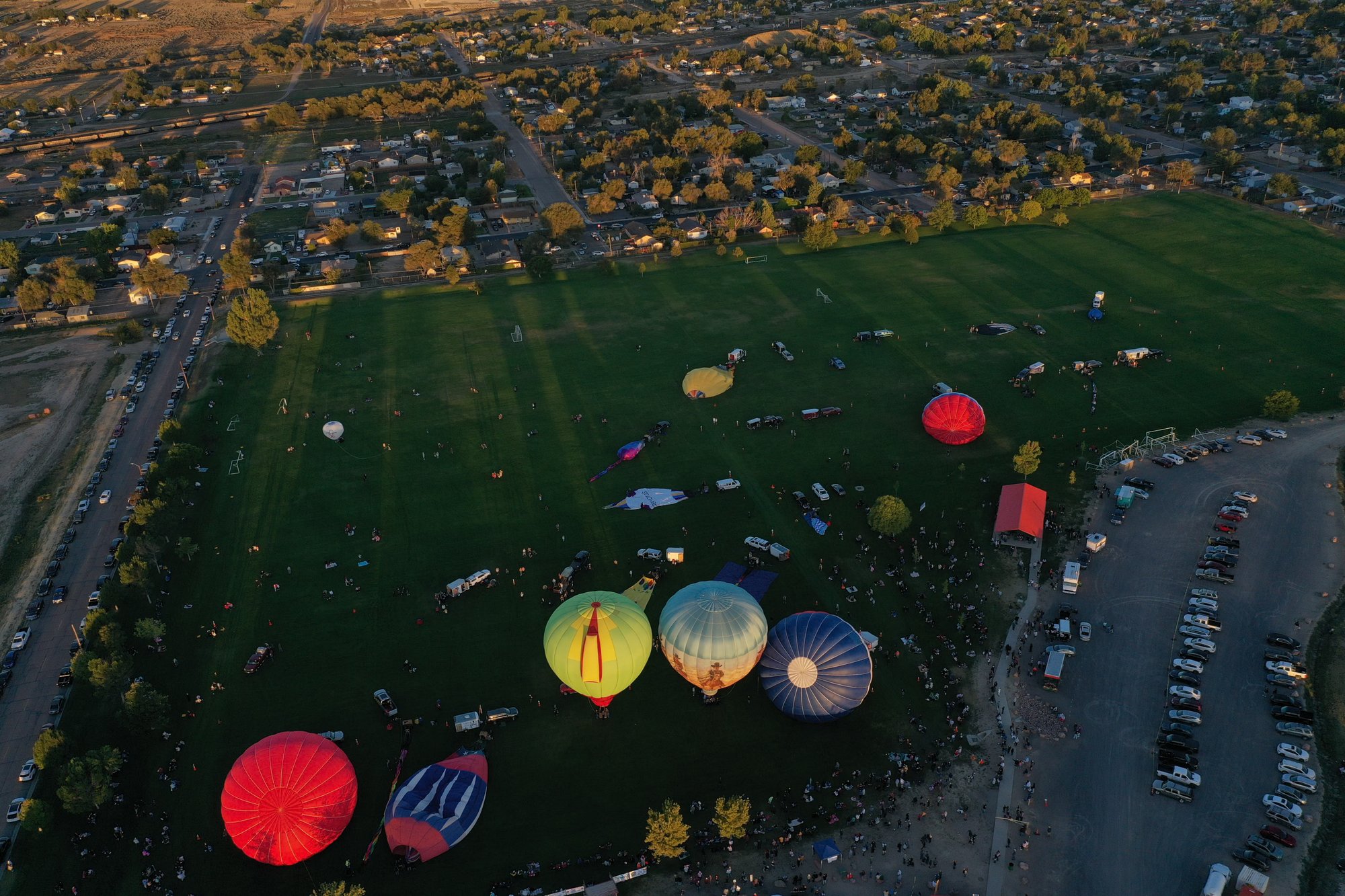 Hot air balloons rising over Colorado, captured from above