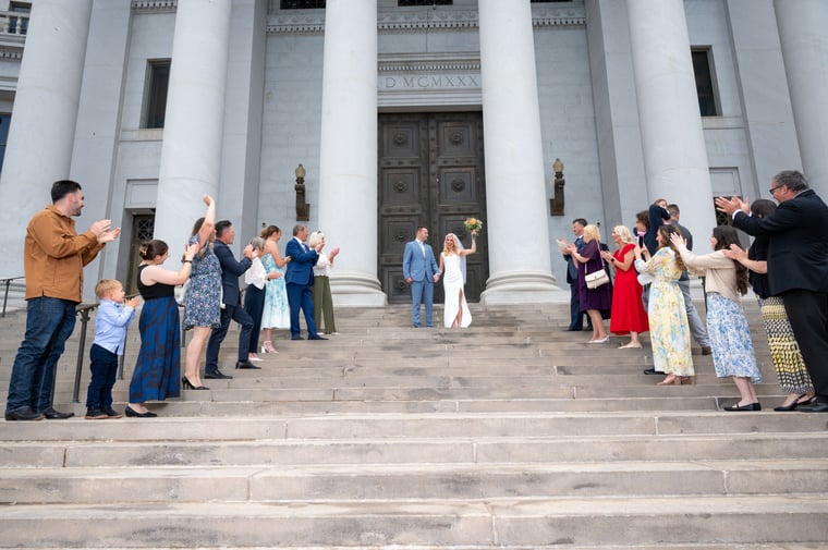 A wedding recessional on grand columned steps