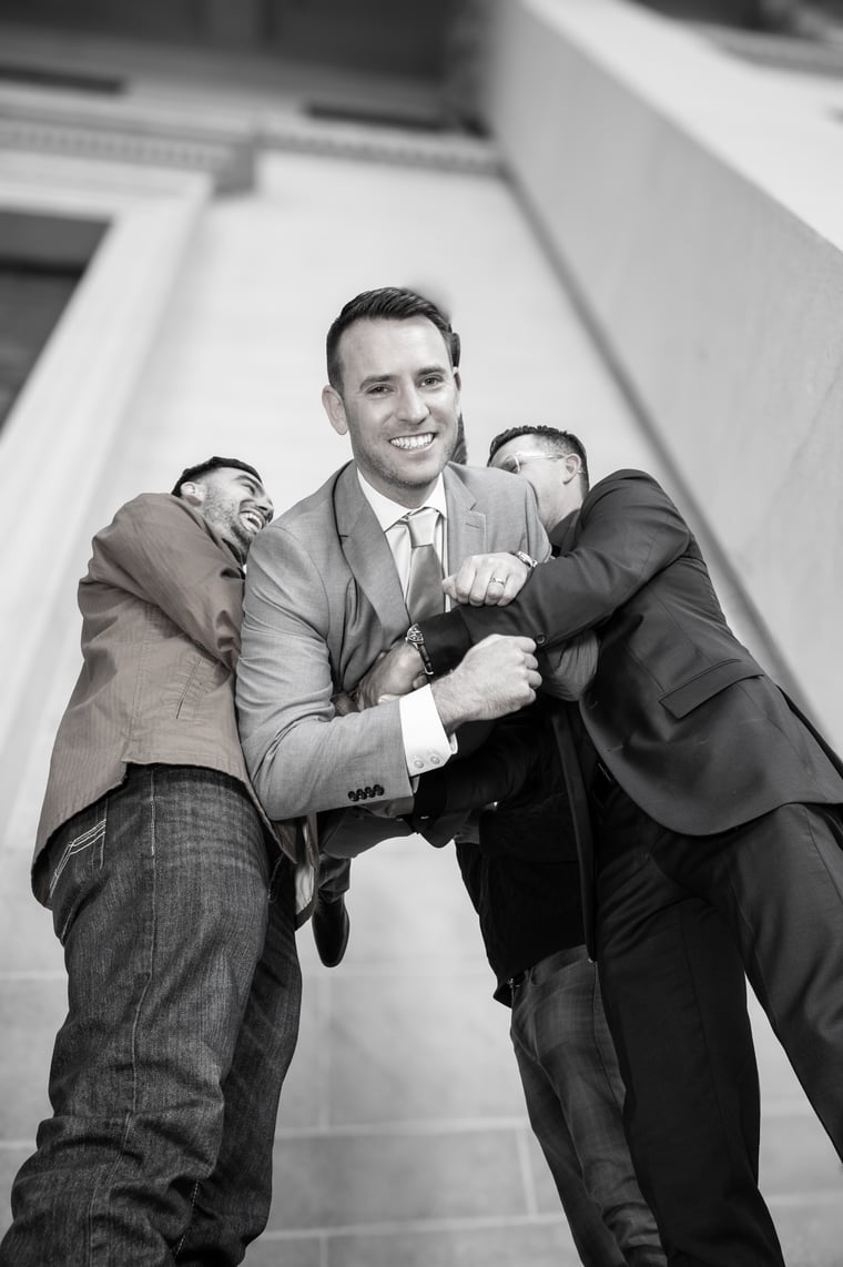A black-and-white detail of the groom before the ceremony