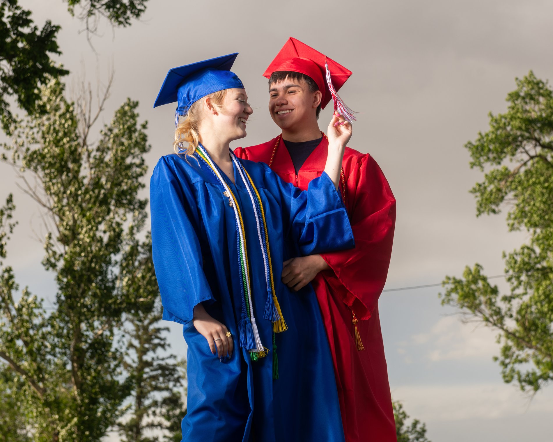Graduates laughing together