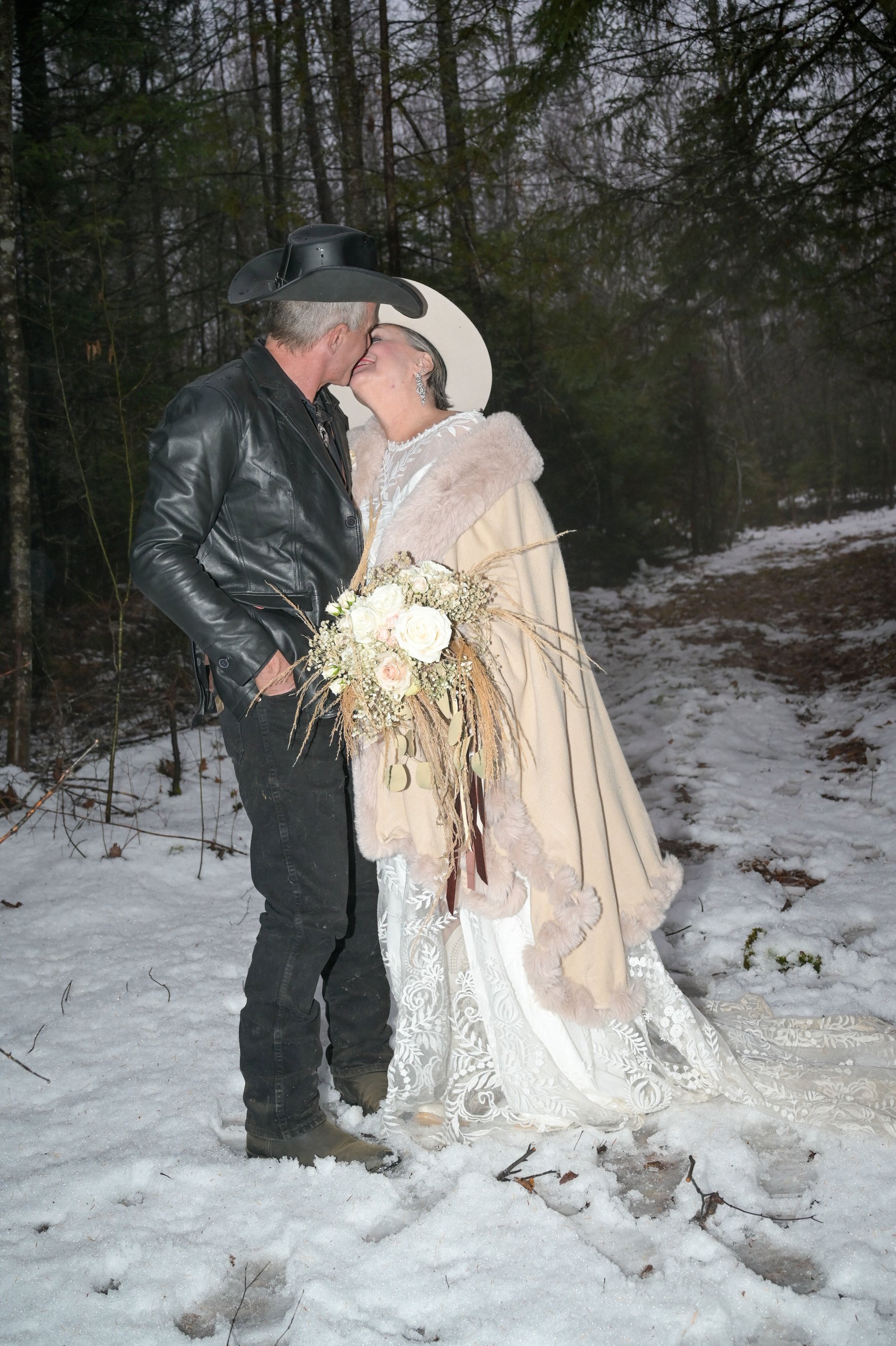 A couple in the snow on their wedding day, Perfectionshoots destination wedding photography