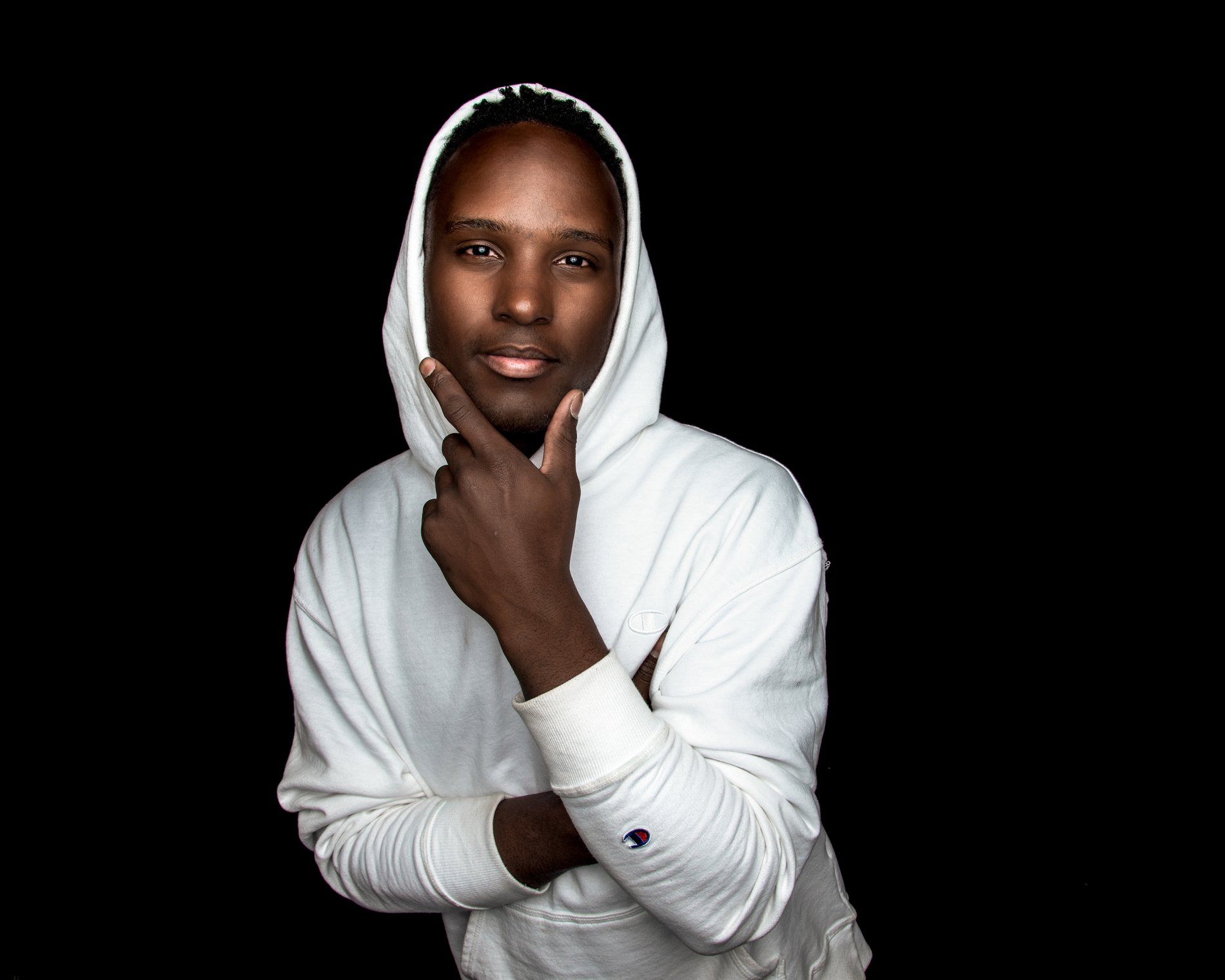 A studio portrait in white against black, Perfectionshoots Colorado portrait photography