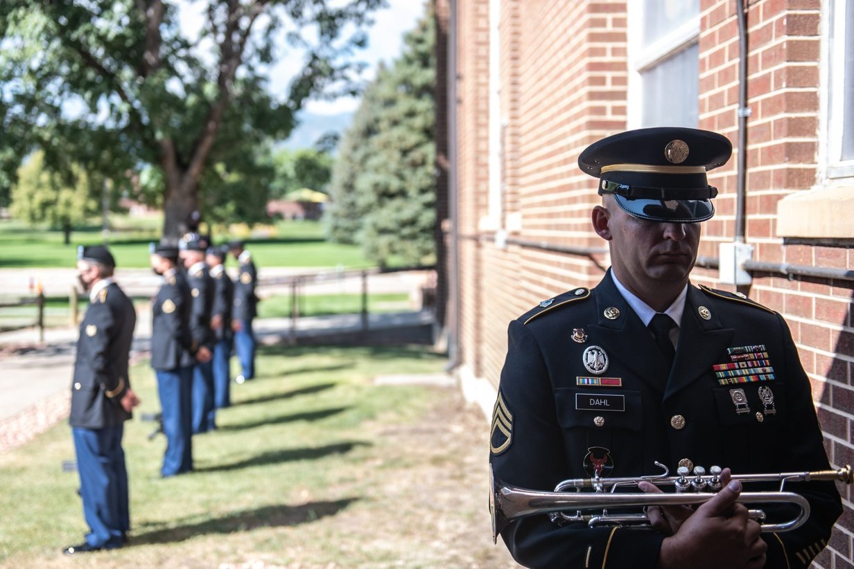 A bugler and honor guard at a memorial ceremony, Perfectionshoots military and veteran event photography