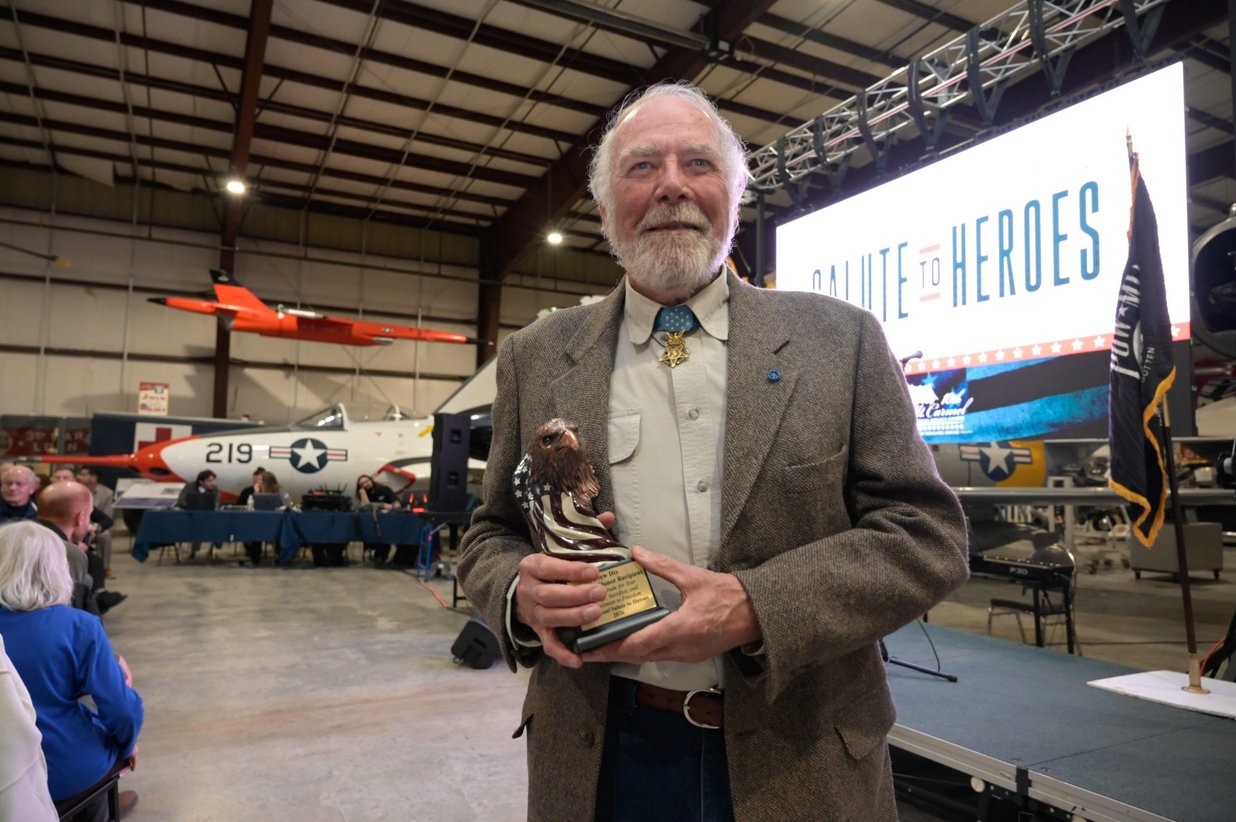 A veteran honored with an award in the hangar, Perfectionshoots military and veteran event photography