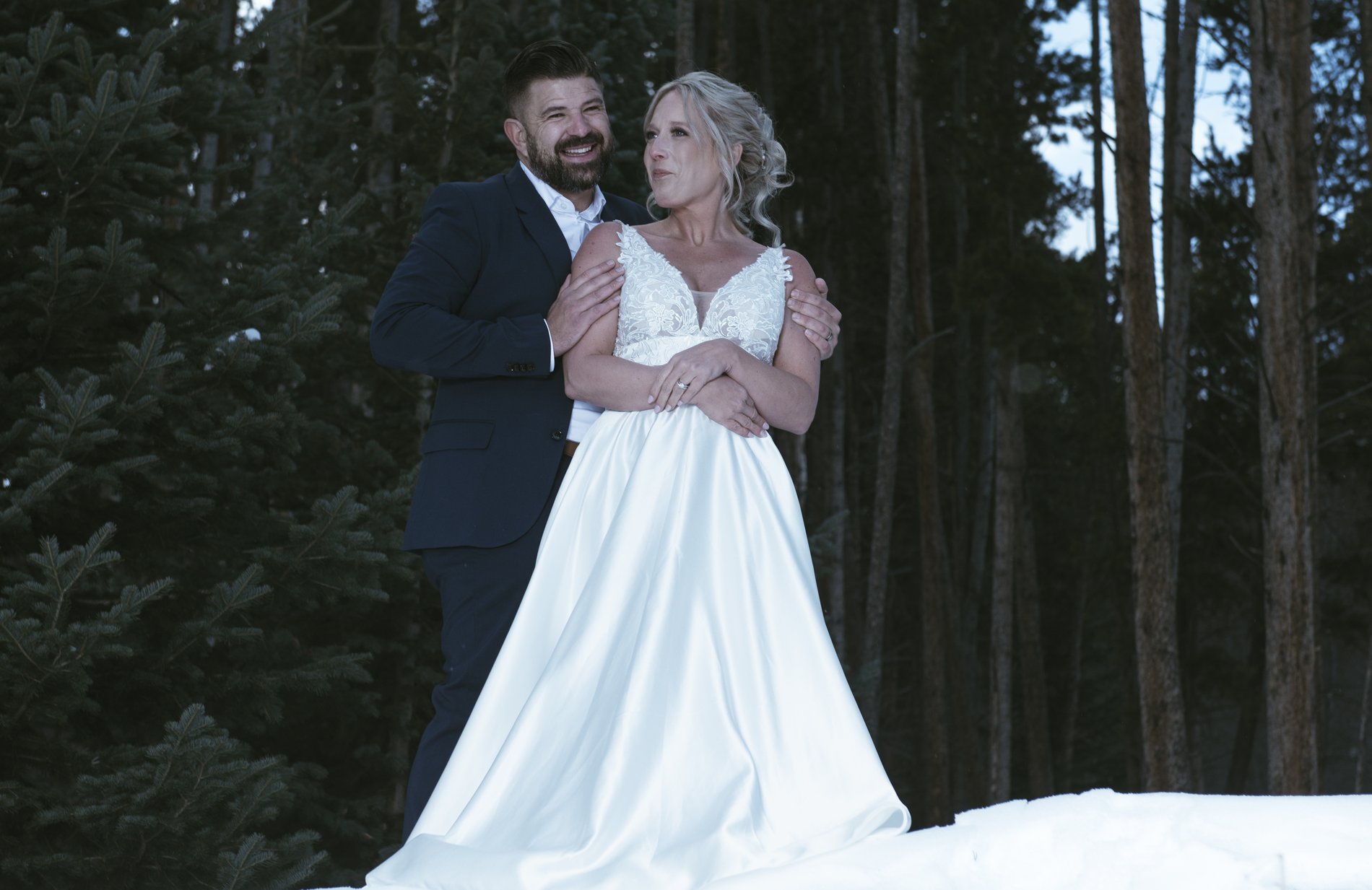 A winter wedding couple portrait in the Colorado pines