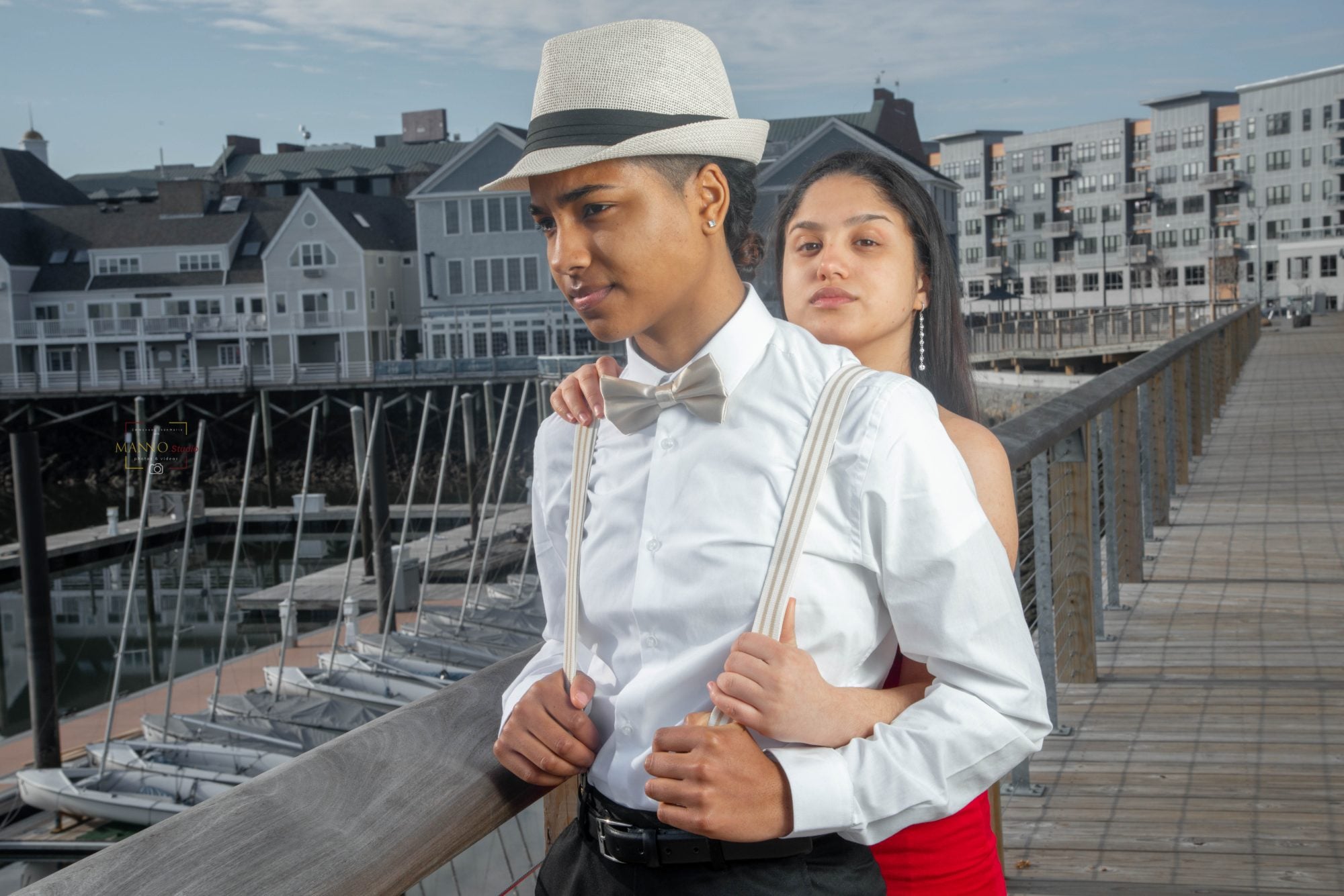 An editorial engagement portrait on the marina boardwalk, Perfectionshoots Colorado wedding photography